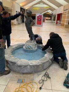 Boy with the Boot Statue